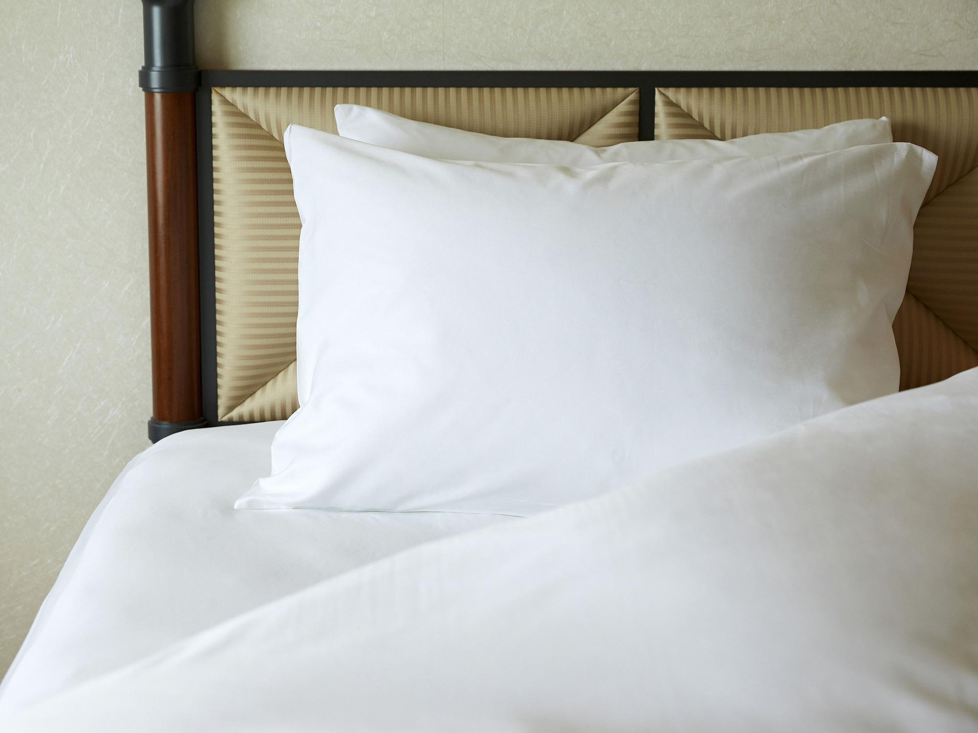 Miyako Hotel Gifu Nagaragawa Buitenkant foto A pillow on a bed